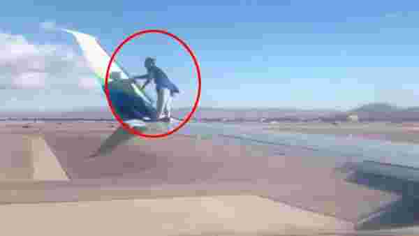 ABD'de bir kişi, kalkış yapmaya hazırlanan uçağın kanadına tırmandı
