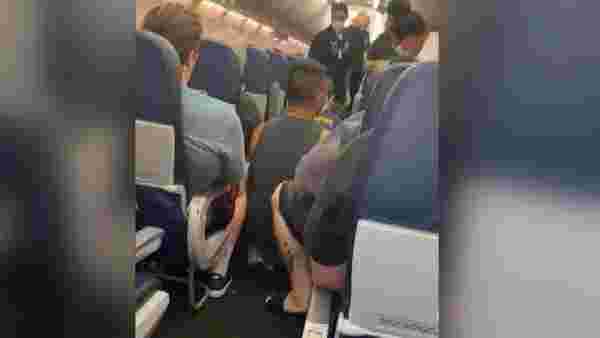 Son dakika dünya: Uçakta koronavirüsten ölen yolcunun görüntüleri ortaya çıktı
