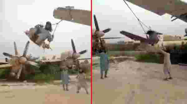 Taliban, ABD'ye ait askeri uçakların kanatlarını salıncağa çevirdi