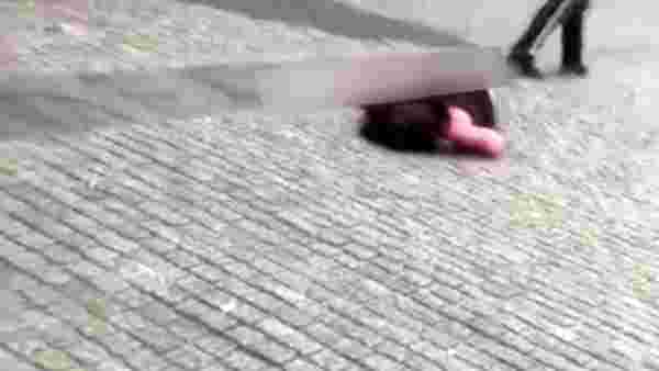 Ukrayna'da bir kişi, yol ortasında tartıştığı kadına tekme atarak bayılttı