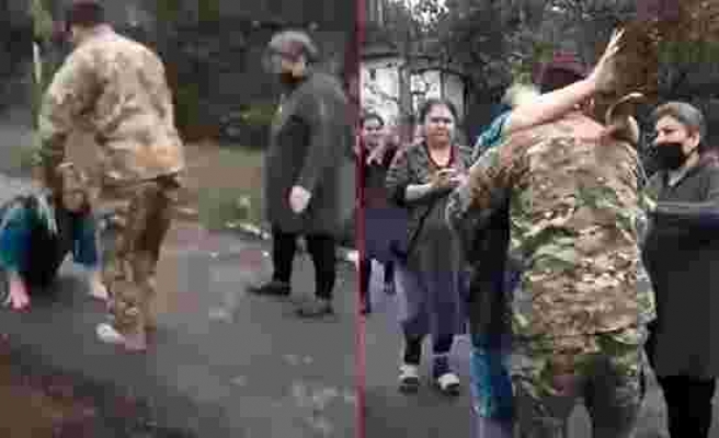 Azerbaycanlı anne, Karabağ'a yolladığı oğlunu ayaklarına kapanarak karşıladı