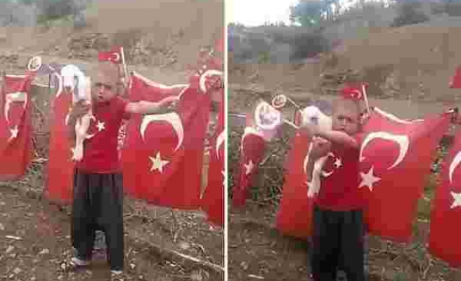 Bir Elinde Türk Bayrağı Diğer Elinde de Kuzu ile 23 Nisan Marşı Söyleyen Ufaklık
