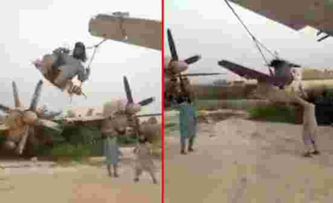 Taliban, ABD’ye ait askeri uçakların kanatlarını salıncağa çevirdi