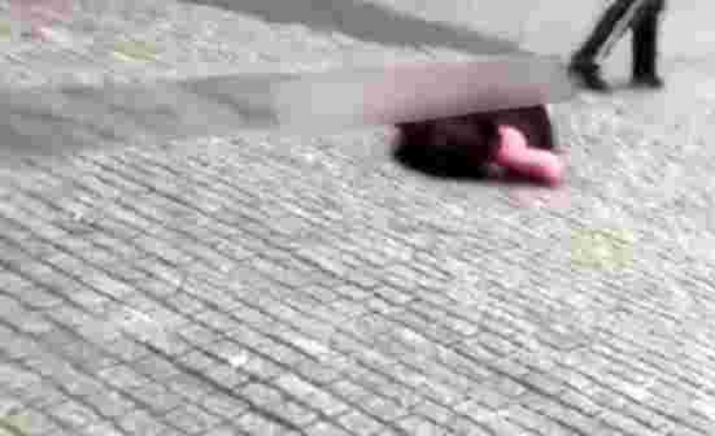 Ukrayna'da bir kişi, yol ortasında tartıştığı kadına tekme atarak bayılttı